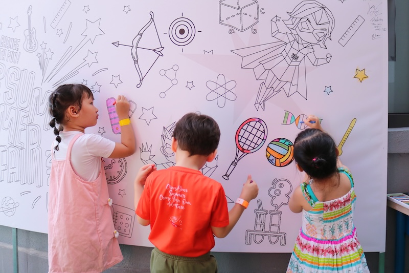 Little VASers concentrate on coloring the Doodle Wall