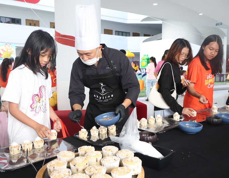 Students prepare and enjoy food at the Cuisine area