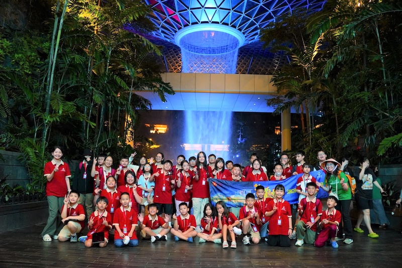VASers excitedly snap a photo at the Rain Vortex in Changi Airport, Singapore